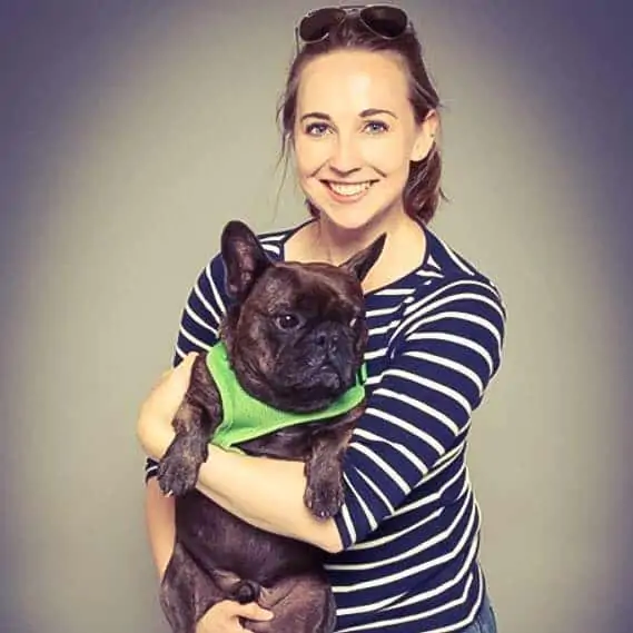 girl smiling with her dog