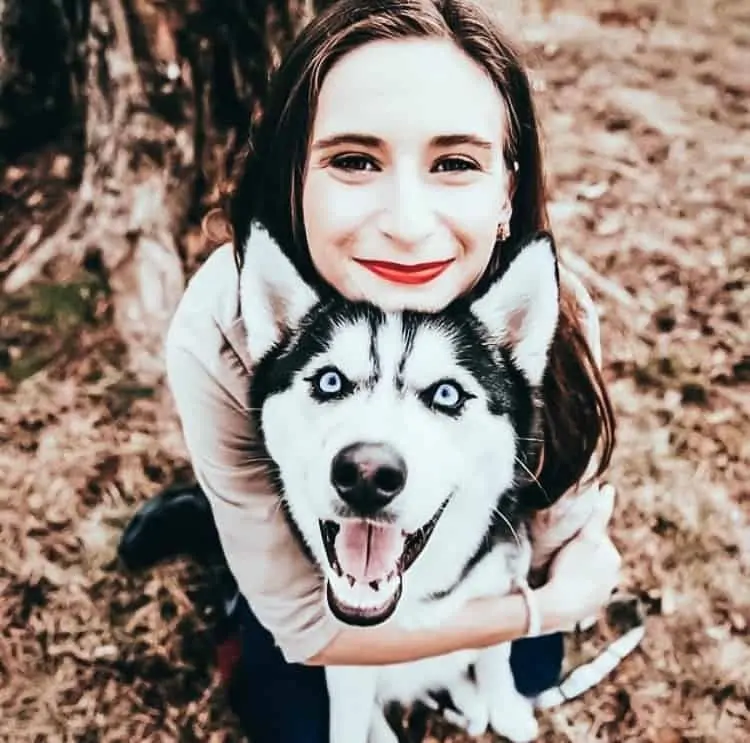 Girl hugging dog