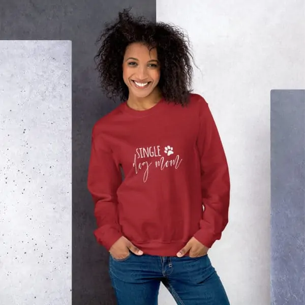 girl wearing red "single dog mom" sweater