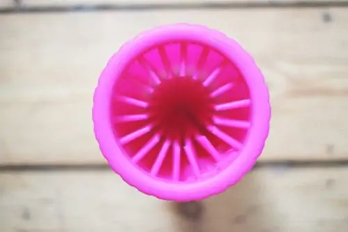 birdseye view into a pink bottle with rubber spikes