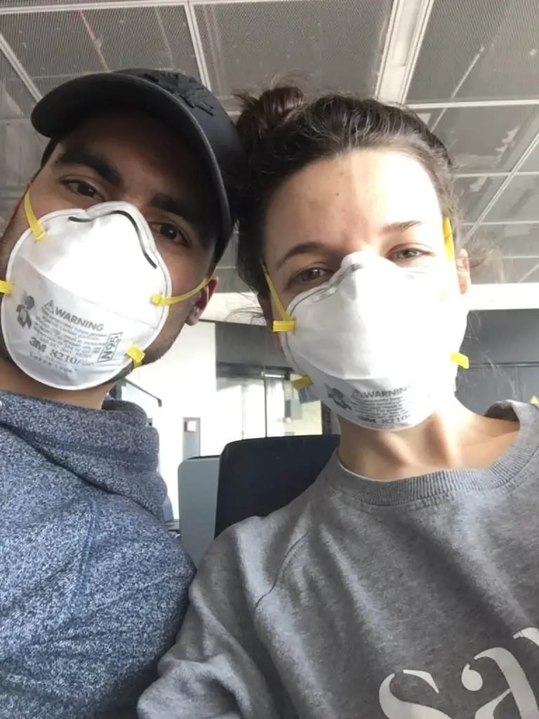 Man and woman wearing N95 masks