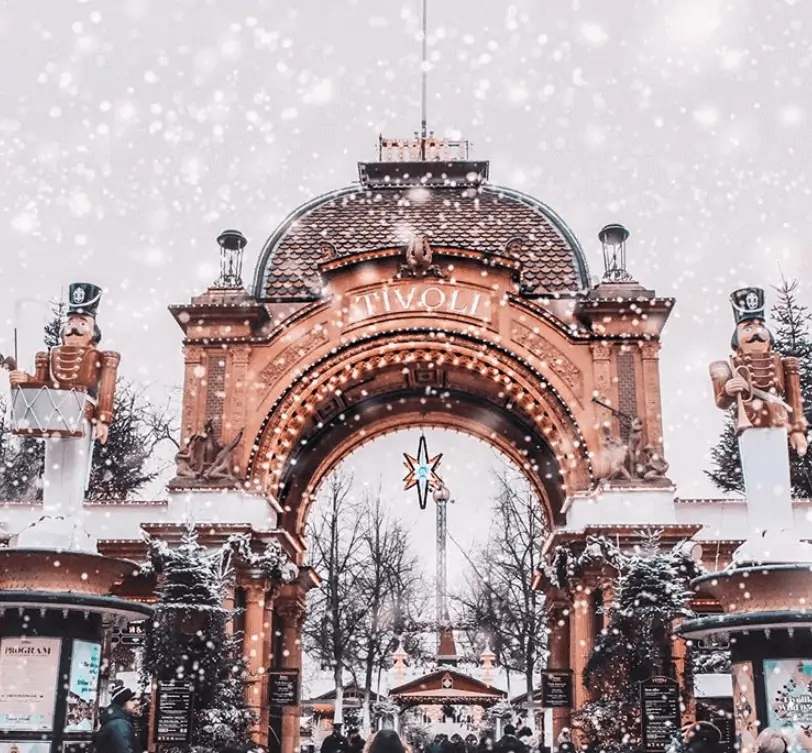 Snow falling at a theme park entrance