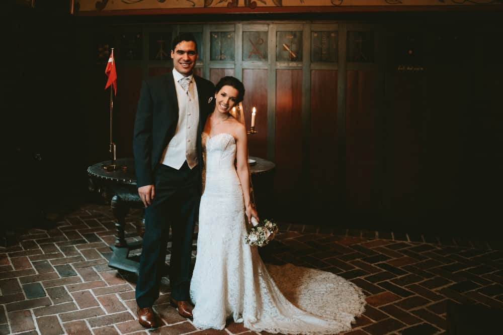 Bridge and groom standing and smiling