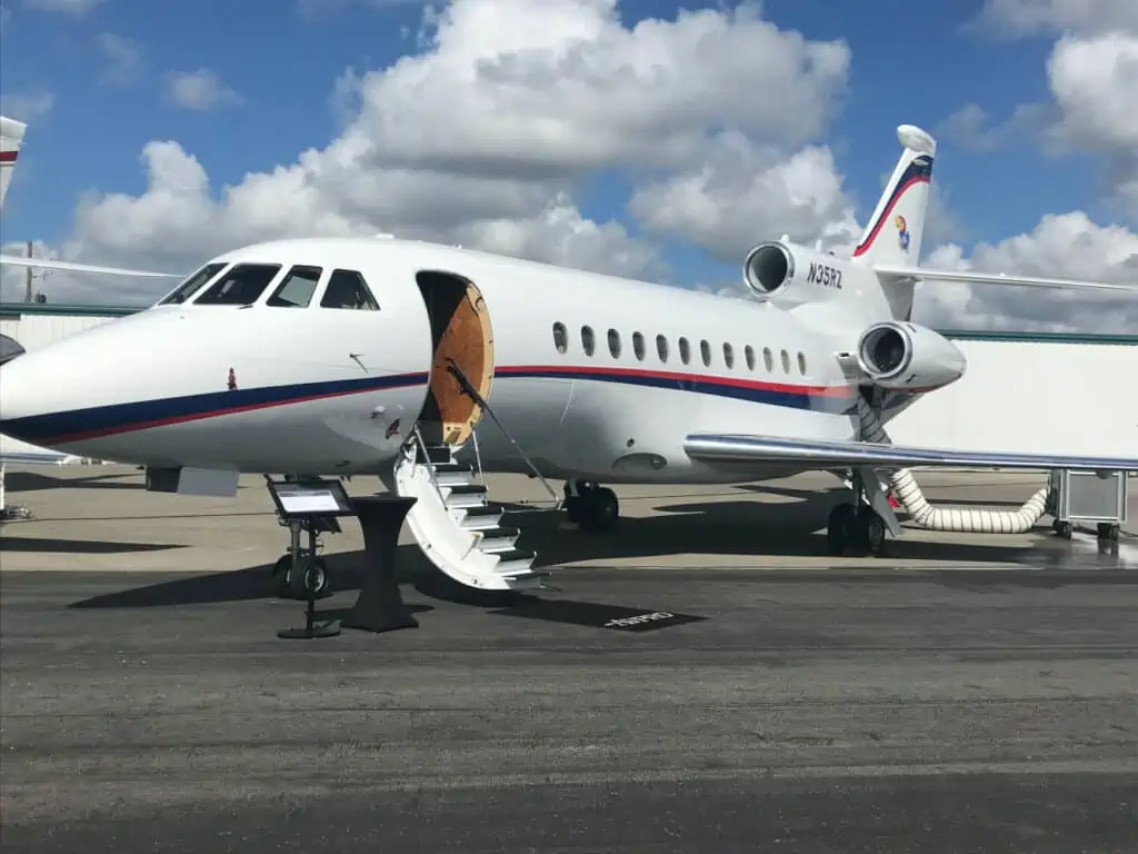 A private airplane with its stairs down.